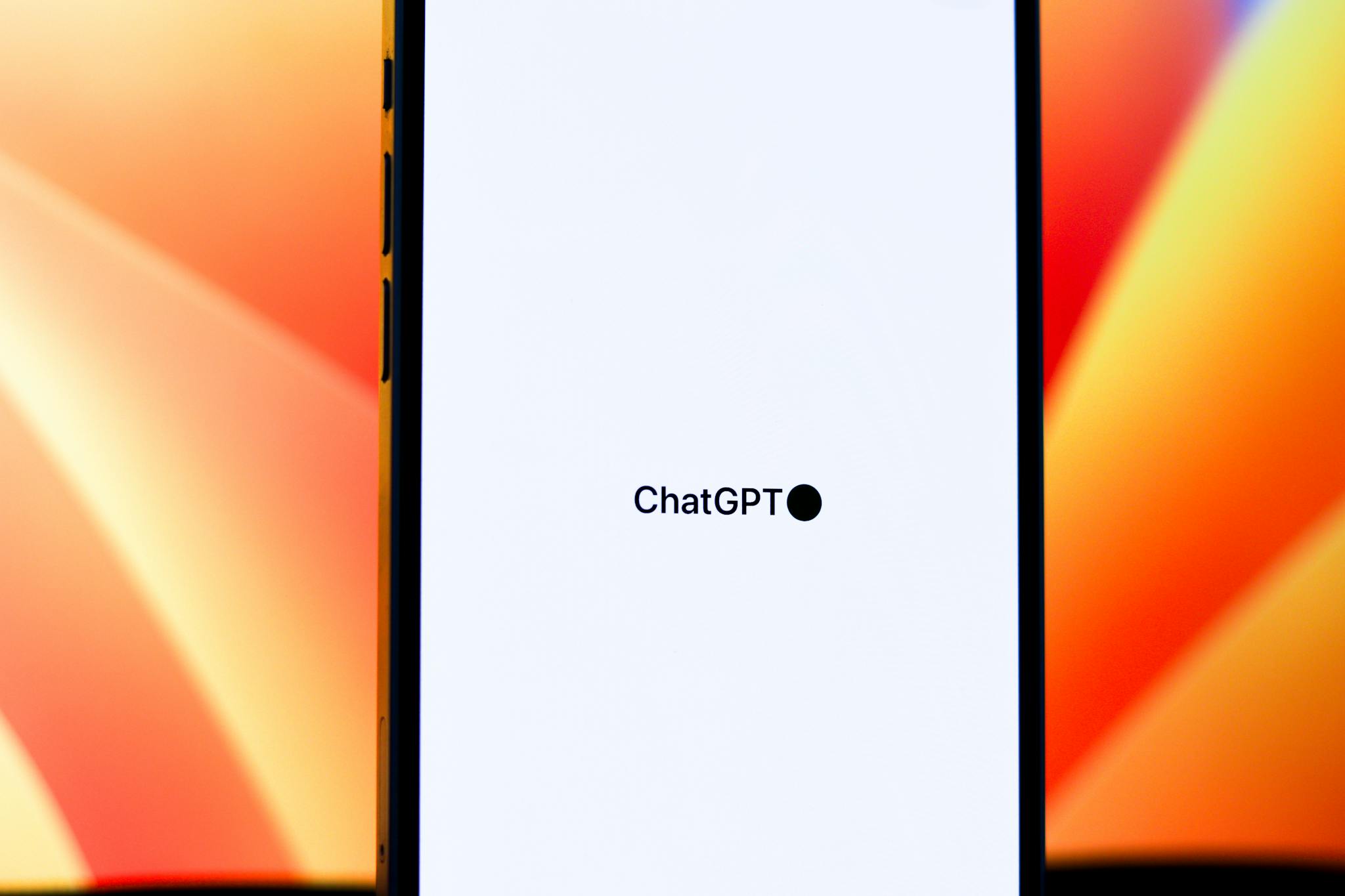 Close-up of a smartphone displaying ChatGPT with vibrant background. Ideal for tech and AI themes.