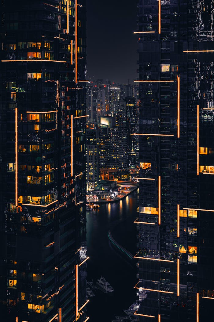 Captivating night view of Dubai skyscrapers illuminated against the dark sky. Perfect for tech and urban themes.